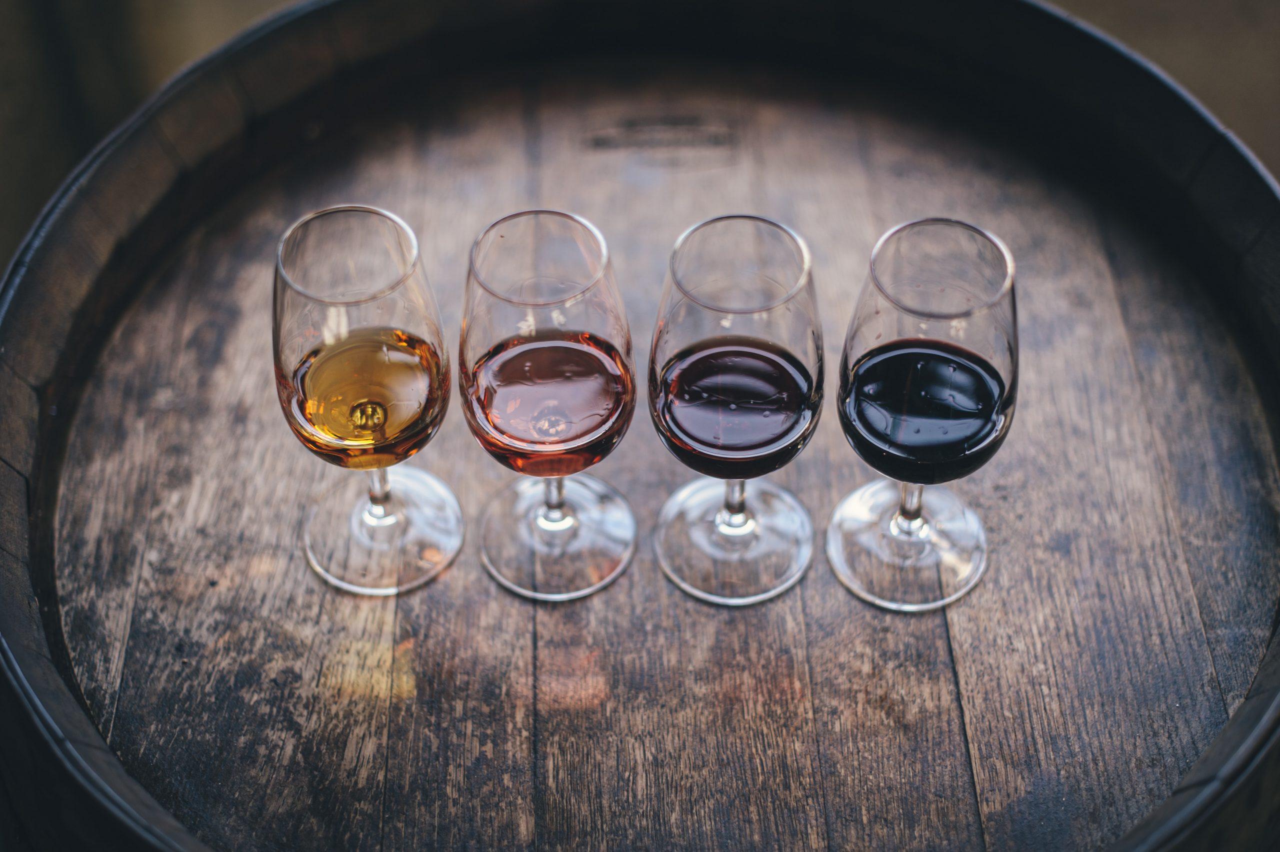Four glasses with different types of wine