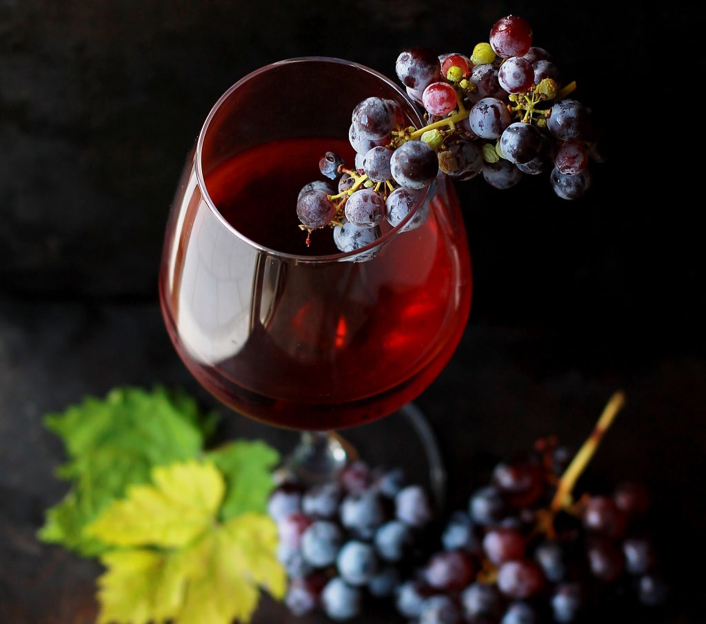 wine glass with grapes inside